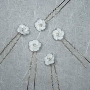 White flower hair pins with clear rhinestone center and gold hardware